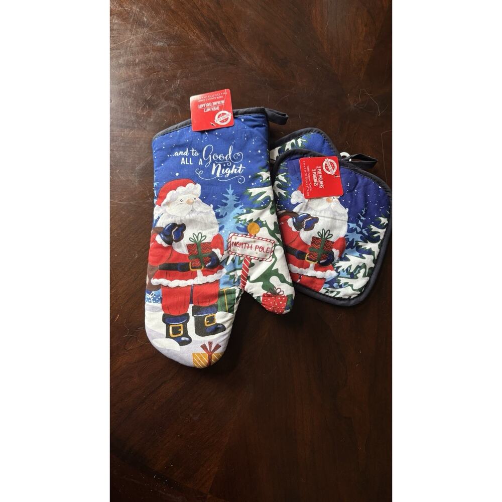 Santa Claus themed kitchen set featuring an oven mitt and two pot holders
